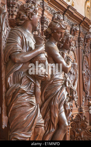 ANTWERP, BELGIUM - SEPTEMBER 5: Carved statue of angel with the mug in St. Charles Borromeo church Stock Photo