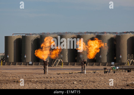 Watford City, North Dakota - Natural gas is flared off as oil is pumped in the Bakken shale formation. Stock Photo