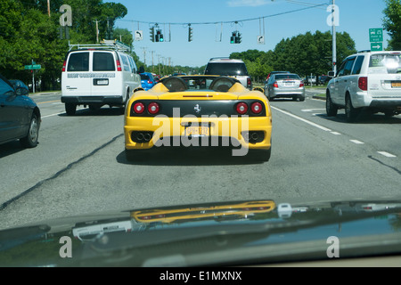 Royal Yellow Ferrari on the road. Stock Photo