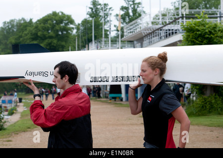 Oxford May Eights, Magdalen College boat being carried out of boathouse, Oxford, UK Stock Photo