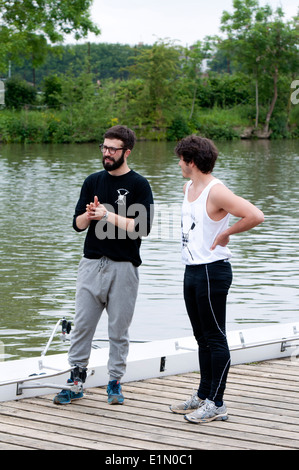 Oxford May Eights, Magdalen College rowers outside their boathouse, Oxford, UK Stock Photo