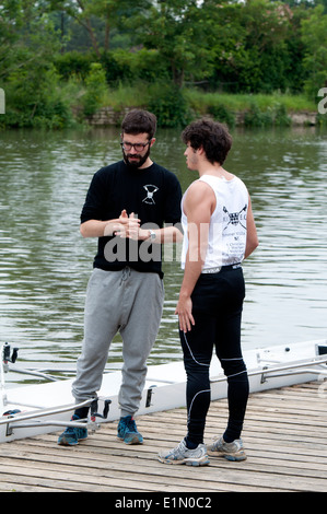 Oxford May Eights, Magdalen College rowers outside their boathouse, Oxford, UK Stock Photo