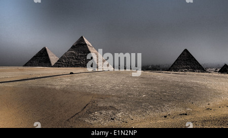 Left : Great Pyramid (Khufu). Middle : Pyramid of Khaefre (khephren). Right : Menkaure (Mykerinus) pyramid. Giza, Egypt. Stock Photo