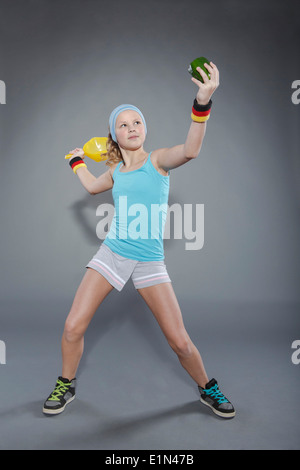 female tennis player with paprika instead of ball Stock Photo