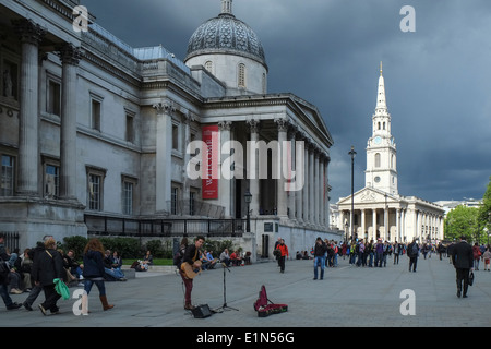 Storm clouds gather over Trafalgar Square in London Stock Photo