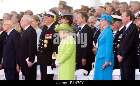 Normandy, France. 06th June, 2014. President of Italy Giorgio Napolitano (first row, L-R), Slovakian President Ivan Gasparovic, King Harald V. of Norway, Britain's Queen Elizabeth II., Queen Margrethe II. of Denmark and Henri Grand Duke of Luxembourg during the 70th anniversary of the D-Day landings, on Sword beach, Ouistreham, Normandy, France, 06 June 2014. Credit:  dpa picture alliance/Alamy Live News Stock Photo