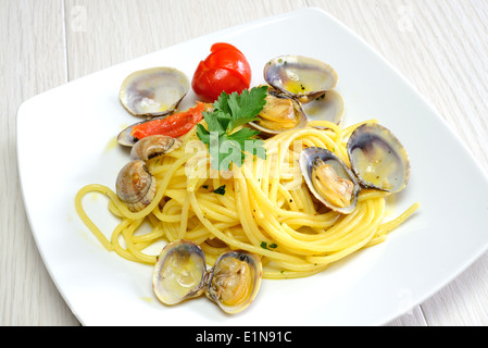 italian traditional food composed by spaghetti pasta and seafood fasolari,clams and mussels Stock Photo