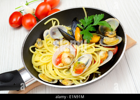 italian traditional food composed by spaghetti pasta and seafood fasolari,clams and mussels Stock Photo