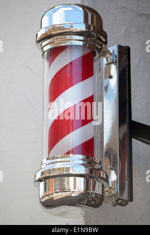 UK, Canterbury, Red and white striped barber's shop pole. Stock Photo