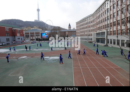 Students doing sports at their school compound. Dalian, Liaoning Province , China. Stock Photo