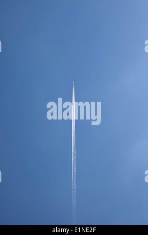 airplane on blue sky white trace Stock Photo