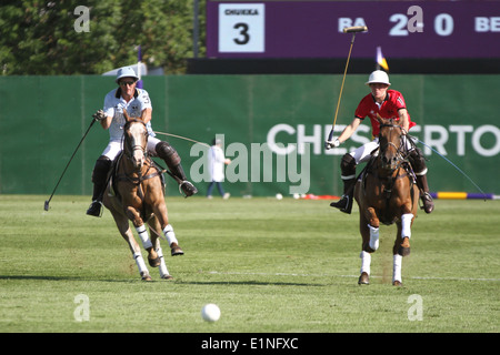 Fernando (Panchito) Torres of Team Buenos Aires v Charlie Wooldridge of Team Beijing at Chestertons polo in the park 2014 Stock Photo