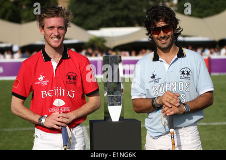 Charlie Wooldridge of Team Beijing & Oscar Mancini of Team Buenos Aires at Chestertons polo in the park 2014 Stock Photo