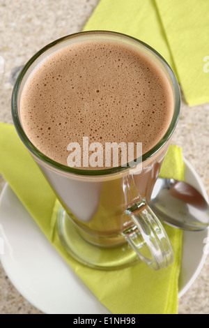 Hot chocolate in a tall latte glass top down view Stock Photo