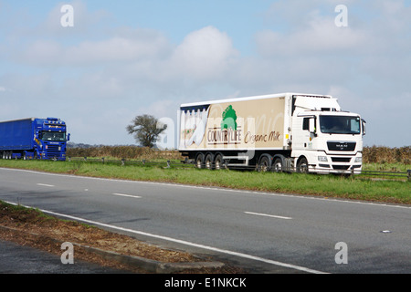 Two trucks traveling along the A417 dual carriageway in The Cotswolds, England Stock Photo