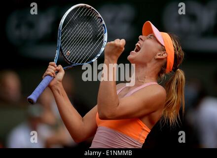 Paris, France. 7th June, 2014. Russia's Maria Sharapova celebrates after winning the women's final match against Romania's Simona Halep at the French Open tennis tournament at the Roland Garros stadium in Paris, France, on June 7, 2014. Sharapova won 2-1. Credit:  Chen Xiaowei/Xinhua/Alamy Live News Stock Photo
