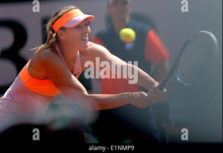 Paris, France. 7th June, 2014. Russia's Maria Sharapova returns the ball during the women's final match against Romania's Simona Halep at the French Open tennis tournament at the Roland Garros stadium in Paris, France, on June 7, 2014. Sharapova won 2-1. Credit:  Chen Xiaowei/Xinhua/Alamy Live News Stock Photo