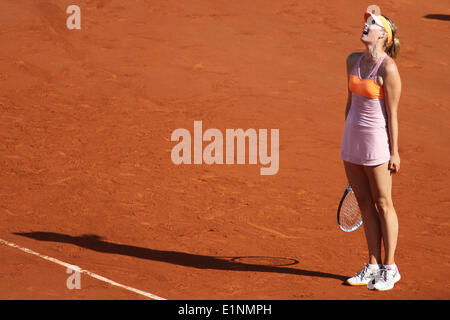 Paris, France. 7th June, 2014. Russia's Maria Sharapova reacts after winning the women's final match against Romania's Simona Halep at the French Open tennis tournament at the Roland Garros stadium in Paris, France, on June 7, 2014. Sharapova won 2-1. Credit:  Zhang Xuefei/Xinhua/Alamy Live News Stock Photo