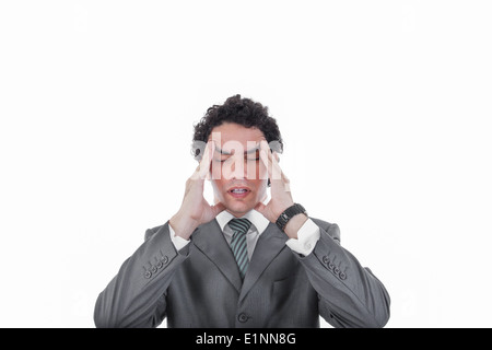 Frustrated business man having severe headache and migraine, Worried businessman suffering from headache Stock Photo