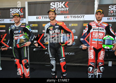 Sepang, Malaysia. 08th June, 2014. Tom Sykes of Kawasaki Racing Team, Sylvain Guintoli of Aprilia Racing Team and Davide Giugliano of Ducati Superbike Team pose for photograph after the completion of the Superpole qualifying session of the FIM Superbike World Championship - Malaysia Round held at Sepang International Circuit in Sepang, Malaysia. Credit:  Action Plus Sports Images/Alamy Live News Stock Photo