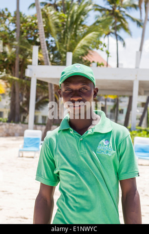 Worker at Playa Turquesa in Bavaro, Dominican Republic Stock Photo
