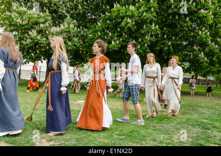 folklorists with national costumes singing in park Stock Photo