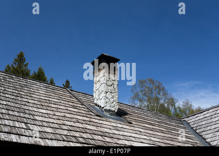 Old, traditional wooden cottage house in a village, Estonia Stock Photo