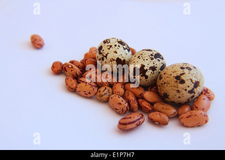 Orange Bean and three quail eggs on white Stock Photo