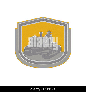 Metallic styled illustration of a farmer worker driving riding a vintage tractor plowing farm field set inside shield crest done Stock Photo