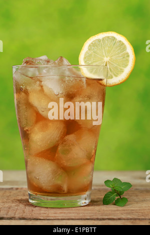 Cool ice tea with ice cubes and a slice of lemon Stock Photo