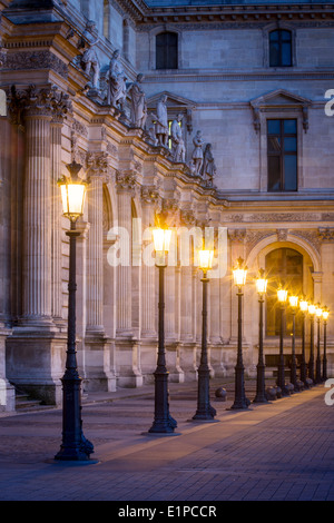 Row of lamps in the courtyard of Musee du Louvre, Paris France Stock Photo