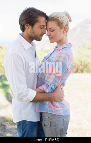 Cute couple standing and hugging Stock Photo
