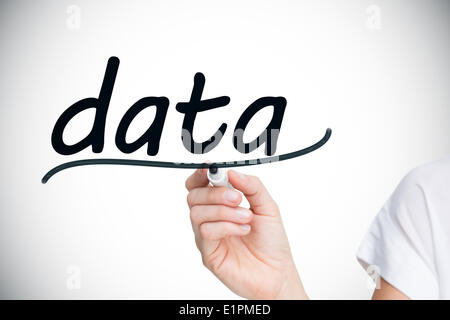 Businesswoman writing the word data Stock Photo