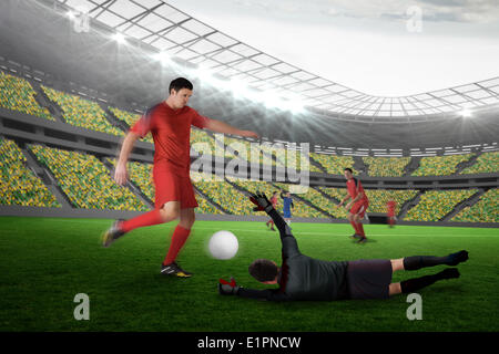 Composite image of football match in progress Stock Photo