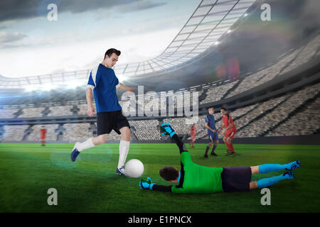 Composite image of football match in progress Stock Photo
