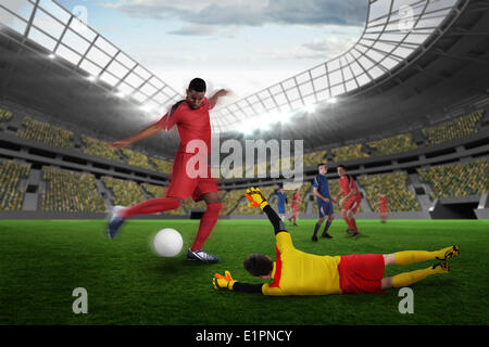 Composite image of football match in progress Stock Photo