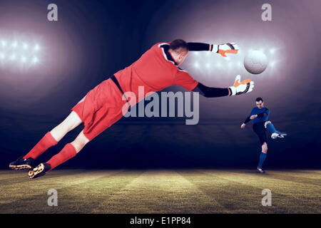 Composite image of fit goal keeper jumping up Stock Photo