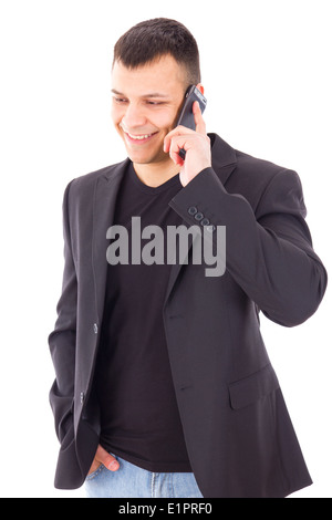 young man in a suit talking over mobile and smiling Stock Photo