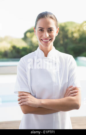 Smiling beauty therapist looking at camera Stock Photo