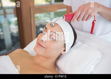 Peaceful brunette getting micro dermabrasion Stock Photo