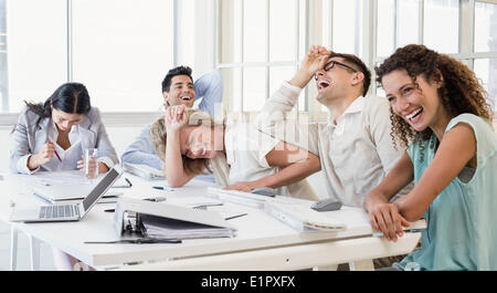 Casual business team laughing during meeting Stock Photo