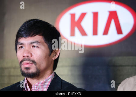 Makati, Philippines. 9th June, 2014. Filipino boxing champion Manny Pacquiao arrives at a press conference in Makati, east of Manila. Manny Pacquaio was appointed as head coach of KIA, a new team joining the local professional basketball league in the Philippines. © Mark Fredesjed R. Cristino/Pacific Press/Alamy Live News Stock Photo