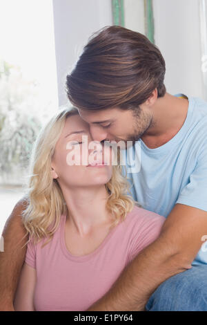 Happy couple relaxing on the couch Stock Photo
