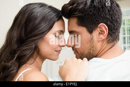 Attractive couple sitting face to face Stock Photo