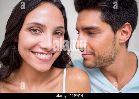 Attractive couple sitting on bed Stock Photo