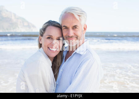 Happy couple hugging on the beach Stock Photo
