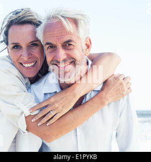 Attractive married couple posing at the beach Stock Photo
