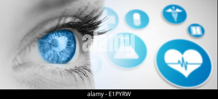 Composite image of blue eye on grey face Stock Photo