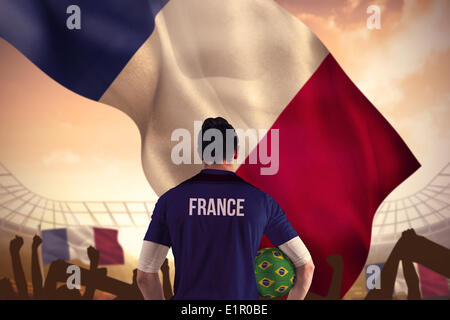 Composite image of france football player holding ball Stock Photo