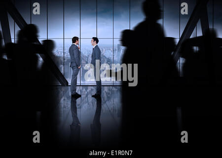Composite image of silhouette of business people walking Stock Photo